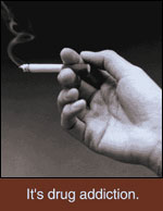 Smoking - It's drug addiction - hand holding cigarette