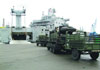 RRF vessel Cape Intrepid loads military vehicles.