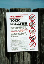 photo of sign warning of toxic shellfish