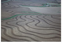 An aerial photo of a plowed farm field.