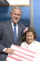 President George W. Bush presented the President’s Volunteer Service Award to Kennedy Kulish, 10, upon arrival in Lancaster, Pennsylvania, on Wednesday, October, 3, 2007.  Kulish, a fifth-grader at Hambright Elementary School, is the founder of the youth service project, Kisses for Kaeden.  To thank them for making a difference in the lives of others, President Bush honors a local volunteer when he travels throughout the United States.  He has met with more than 600 volunteers, like Kulish, since March 2002.