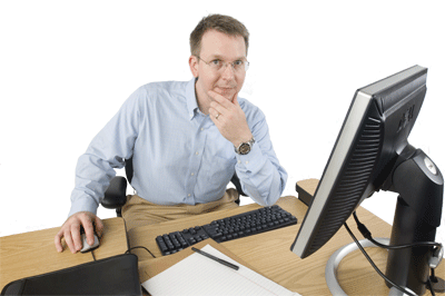 Image of a financial analyst working at his desk