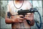 Photograph of MS-13 member with 9mm uzi 