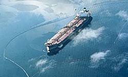 Exxon Valdez tanker encircled by containment boom. Photo: EVOS Trustee Council