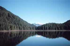 Blue sky over blue lake.