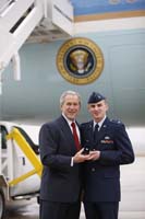 President George W. Bush presented the President’s Volunteer Service Award to Rob Goodreau upon arrival at Wright-Patterson Air Force Base, Ohio, on Thursday, March 27, 2008.  Goodreau is a volunteer with the Civil Air Patrol.   To thank them for making a difference in the lives of others, President Bush honors a local volunteer when he travels throughout the United States.  He has met with more than 600 volunteers, like Goodreau, since March 2002.