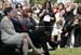 The cameras are turned to President George W. Bush as he sits with Ellen Patton, left, and Colleen Saffron, two of the six recipients of the President's Volunteer Service Award, during Military Spouse Day ceremonies Tuesday, May 6, 2008, on the South Lawn of the White House.