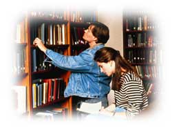 Photo of students looking for books.