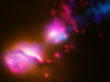 black hole jet at the center of a galaxy strikes the edge of another galaxy