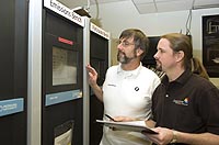 Argonne mechanical engineer Thomas Wallner, right, reviews data from emissions tests conducted on the BMW Hydrogen 7 Mono-Fuel demonstration vehicle