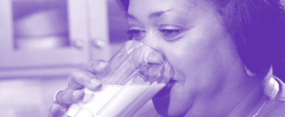 Lady drinking a glass of milk