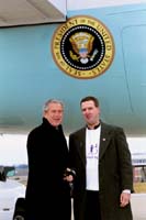 President George W. Bush met Jeff Tank upon arrival in St. Louis, Missouri, on Monday, January 5, 2004.  Tank has been an active volunteer with Big Brothers Big Sisters of Eastern Missouri for the past two years.