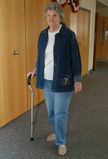 Photo of a woman using a cane. - Click to enlarge in new window.