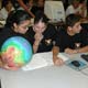 Students study globe of Mars