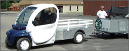Photo of an electric cart with trailer.