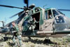 Members of a pararescue team leave an HH-3E Jolly Green Giant helicopter to begin a search and rescue mission during Exercise