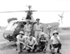 Carter Harmon (standing, on the left) performed the first helicopter evacuation in a combat zone on April 25, 1944, in the hig