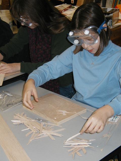 Student forming wing ribs