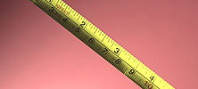 A tape measure that shows inches and centimeters