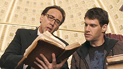 Ben Gates and Riley Poole peruse the Book of Secrets