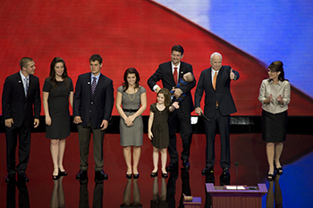Sen. John McCain joins the Palin family on stage