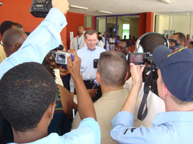 Secretary Mike Leavitt (center) at a press conference in front of the hospital after the tour of the University Hospital de la Paix in Port-au-Prince, Haiti.