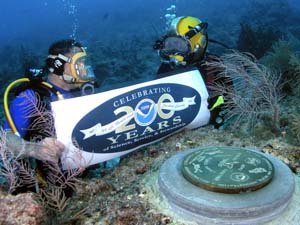 NOAA image of the survey marker dedication near the NOAA Aquarius undersea lab off the coast of Key Largo, Fla.