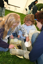 Exploring aquatic insects at Kids Day.