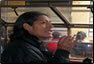 Photo Thumbnail: While in Peru, LT Timothy McCreary, a physician assistant, discusses health procedures with a patient at the Huacho clinic. 