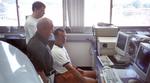 John Dixon, Warren Keenan, and Dan Wolfe (left to right) exercising profiler electronics for the first time (July, 2000).