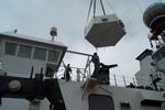 Loading the antenna onto R/V RHB in Seattle (August, 2000).