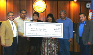 Don Davis presented check to CRIT tribal council