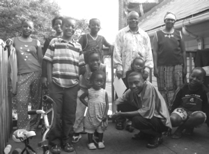 Benjamin Havyarimana with wife Anelise (standing, right) and family.