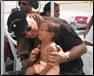 photo thumbnail: LCDR David Campbell, a nurse practitioner, conducts a medical evaluation on a young patient to help diagnose any existing ailments at the Escuela Santa Isabel in Escuintla in the Republic of Guatemala.