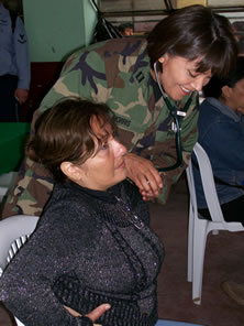 LT Katherine Morris, a physician assistant, examines a patient as part of Operation Continuing Promise