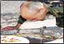 Photo Thumbnail: While in Huacho, Peru, 
LCDR Michael Copeland, an environmental engineer, inspects a drinking water reservoir.