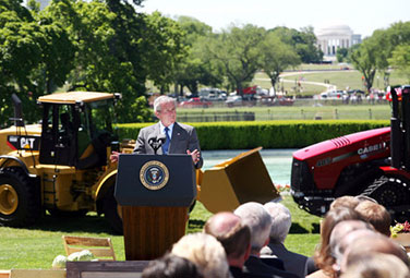 President George W. Bush speaks from the South Lawn with a backdrop of U.S.–made products. Bush delivered remarks in recognition of World Trade Week on Friday, May 23, 2008, at the White House. (White House photo by Eric Draper)