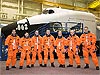 STS-124 crew members wearing training versions of their shuttle launch and entry suits