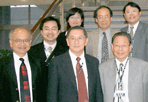 NHRI staff stand with Dr. Li