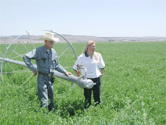 Klamath Basin farmer with cost-shared wheel-line 
        sprinkler system that replaced his flood irrigation.