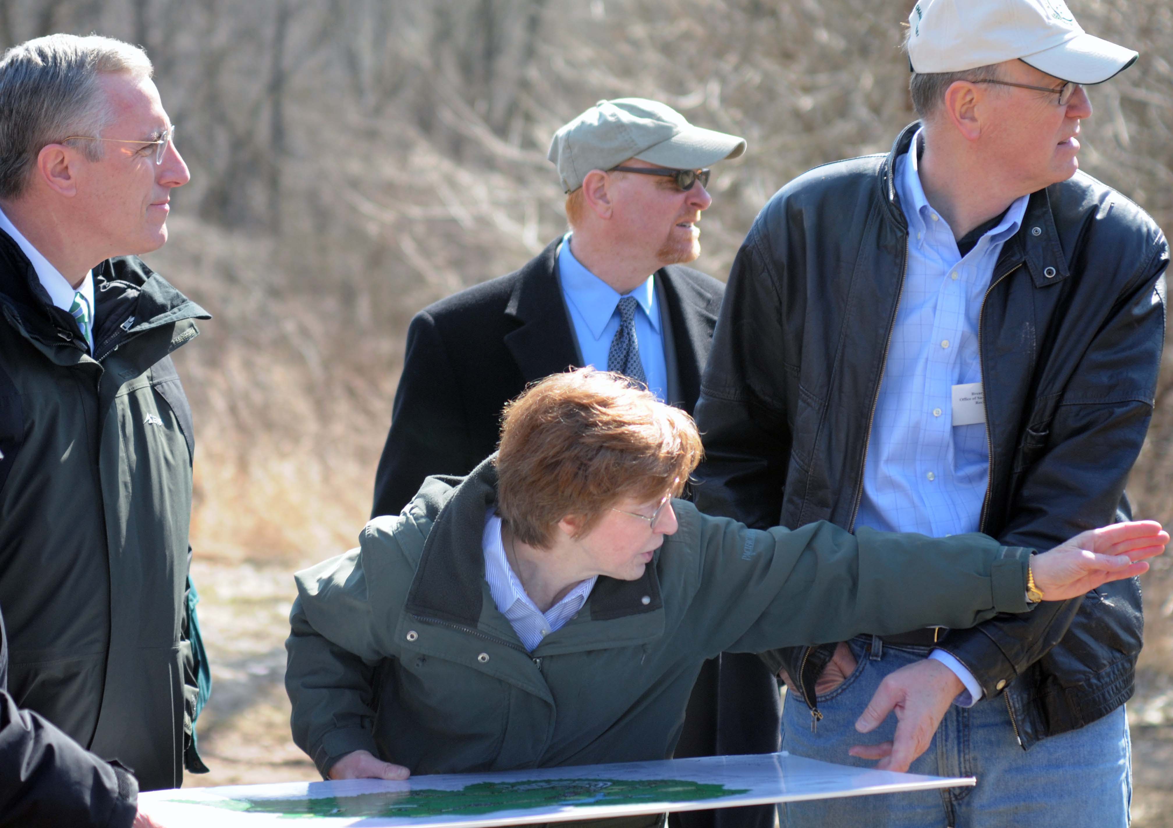Lindsey Totten of the Botanic Garden of Western Pennsylvania points out future features of the Garden to U.S. Congressman Tim Murphy (left), Andrew G. Baechle, Director of the Allegheny County Parks Department (center), and OSM Director Brent Wahlquist (right).