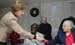 Mrs. Laura Bush reaches out for the hand of a resident of the Little Sisters of the Poor during a visit Tuesday, Dec. 18, 2007, with President George W. Bush to the Washington, D.C. facility that provides nursing and assisted living services to elderly people of lesser means.