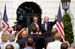 Singer and songwriter Michael W. Smith stands with President Bush on the South Lawn of the White House at the conclusion of an event highlighting the accomplishments of USA Freedom Corps, the volunteer initiative launched as part of a national Call to Service after the attacks of 9/11 to help more Americans connect with opportunities to serve their neighbors in need.  Smith is also vice chairman of the President's Council on Service and Civic Participation.