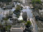 Homes in this neighborhood are surrounded by flood water.