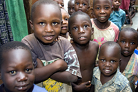 Local children are pictured during a site visit to Reach-Out Mbuya Kinawataka Clinic. Photo by Arne Clausen.