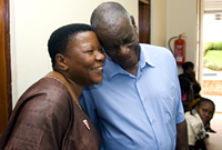 Dr. Noerine Kaleeba (left), founder and patron of The AIDS Support Organization (TASO) is pictured with a member of the TASO staff during a June 4, 2008 site visit coinciding with the 2008 HIV/AIDS Implementers’ Meeting. Photo by Arne Clausen.
