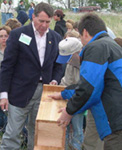 Congressman Gil Gutknecht (left) worked with Bill Hunt,  Minnesota NRCS State Conservtionist (center) and NRCS Chief Bruce Knight, to erect a wood duck nesting house on the Bhagyam property at this week's celebration (photo courtesy of The Farmer)