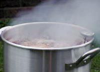 Pot of boiling water - it takes heat to turn water into steam. 