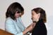 Deputy Assistant to the President and Director of the USA Freedom Corps Desiree Sayle presents Amanda Lynn with the Presidential Volunteer Service Award.  Director Sayle delivered the keynote address at the 2005 Congressional Award Gold Medal Ceremony, where 164 of the 242 award recipients were in attendance.