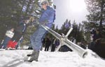 Deputy Under Secretary Natural Resources and Environment Merlyn Carlson dumps snow out of a sampling tube at the Mount Rose Ski Area near Reno to help celebrate the NRCS Snow Survey Centennial
